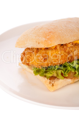 Burger with golden crumbed chicken breast