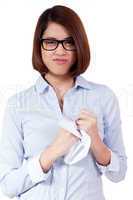 young frustrated asian business woman with paperwork crumpled