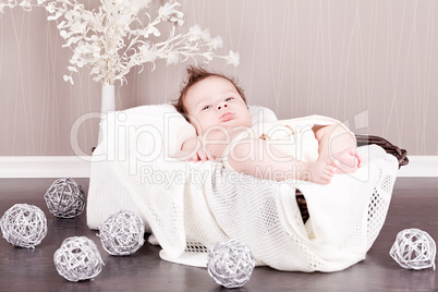 sweet little baby infant toddler on blanket in basket