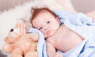 cute little baby todler infant lying on blanket