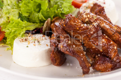 grilled beef stripes fresh salad and goat cheese