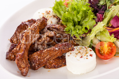 grilled beef stripes fresh salad and goat cheese