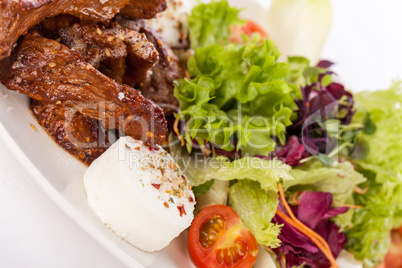grilled beef stripes fresh salad and goat cheese