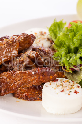 grilled beef stripes fresh salad and goat cheese