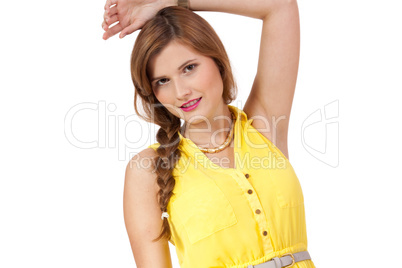 smiling young brunette woman in yellow dress isolated