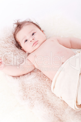 cute little baby infant toddler on white blanket portrait