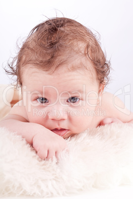 cute little baby infant toddler on white blanket portrait