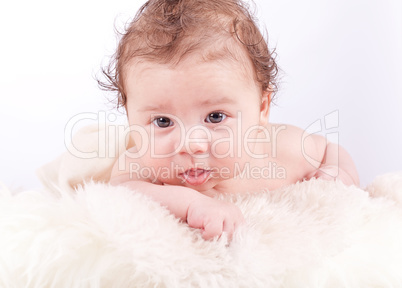 cute little baby infant toddler on white blanket portrait