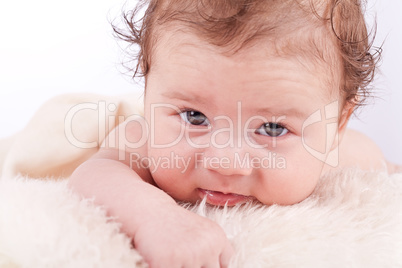 cute little baby infant toddler on white blanket portrait