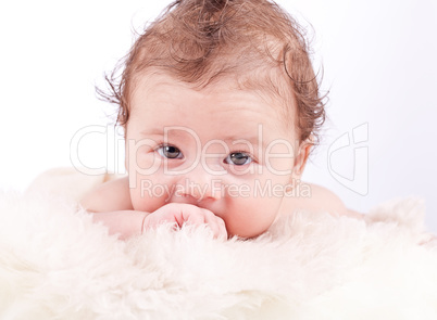 cute little baby infant toddler on white blanket portrait