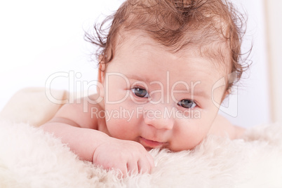 cute little baby infant toddler on white blanket portrait