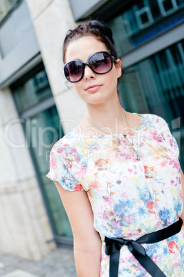 attractive woman with sunglasses in the city summertime