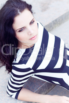 beautiful woman in sexy dress on stairs summertime