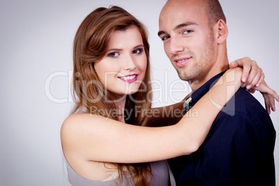 young attractive couple in love embracing portrait