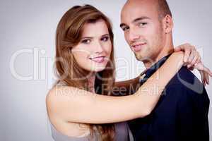 young attractive couple in love embracing portrait