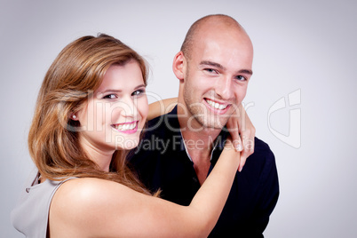 young attractive couple in love embracing portrait