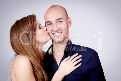 young attractive couple in love embracing portrait