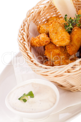 Crumbed chicken nuggets in a basket