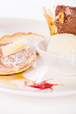 tasty sweet pancakes with vanilla icecream and topping