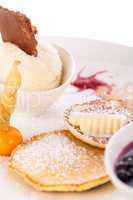 tasty sweet pancakes with vanilla icecream and topping