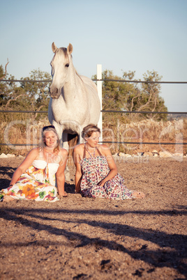 two woman horse and dog outdoor in summer happy