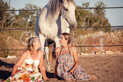 two woman horse and dog outdoor in summer happy