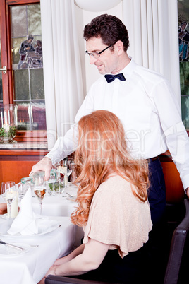 man and woman for dinner in restaurant