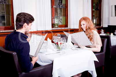 man and woman in restaurant for dinner