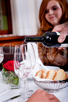 couple drinking red wine in restaurant