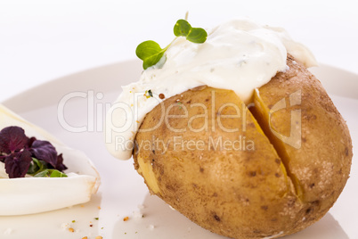 Baked jacket potato with sour cream sauce