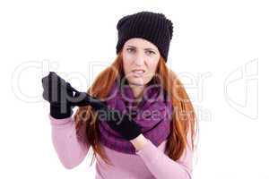 young beautiful woman with hat gloves and scarf in winter isolated