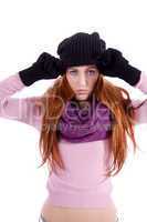 young beautiful woman with hat gloves and scarf in winter isolated
