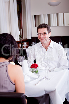 happy smiling couple in restaurant