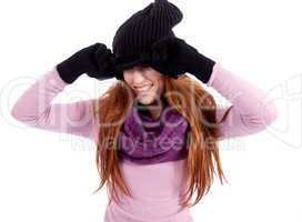 young beautiful woman with hat gloves and scarf in winter isolated