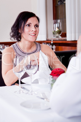 happy smiling couple in restaurant