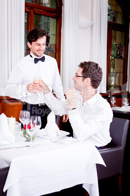 happy smiling couple in restaurant