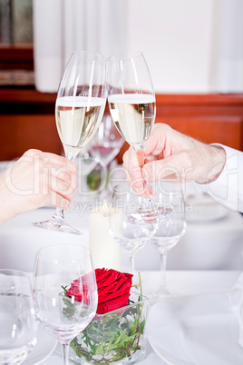 happy smiling couple in restaurant celebrate