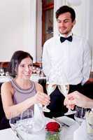 happy smiling couple in restaurant celebrate