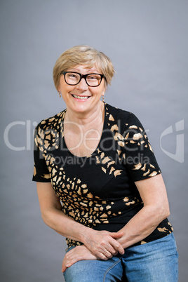 Attractive blond senior woman wearing glasses