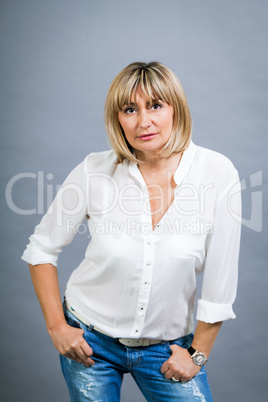 Smiling confident middle-aged blond woman