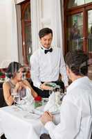 young smiling couple at the restaurant