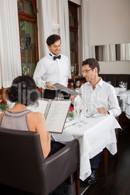 young smiling couple at the restaurant