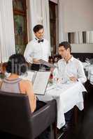 young smiling couple at the restaurant