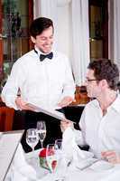 man and woman in restaurant for dinner