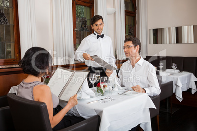 young smiling couple at the restaurant