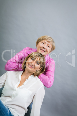 Senior lady with her middle-aged daughter