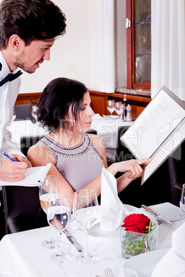 man and woman in restaurant for dinner