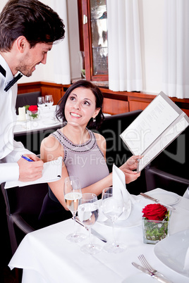 man and woman in restaurant for dinner