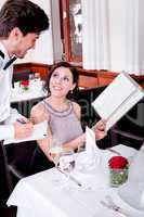 man and woman in restaurant for dinner