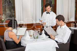 young smiling couple at the restaurant